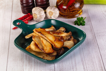 Roasted eringi mushrooms in the plate