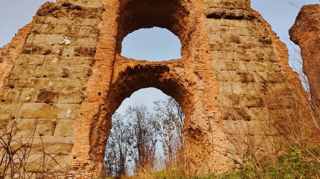 The sun sets on the Park of the Aqueducts or Parco degli Acquedotti in Rome, Italy