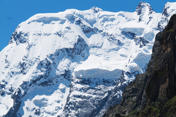 Snow-capped mountain peaks before avalanches