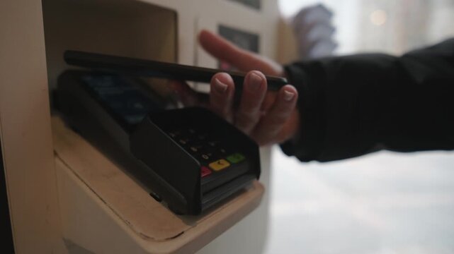 Girl Using Nfc To Pay Contactless With Smartphone At Pos Terminal