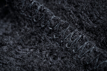The fabric of black fleece, a synthetic knit with a soft, fluffy texture © Alexander