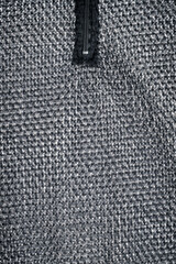 Texture of black fleece, shaggy high-tech synthetic knit