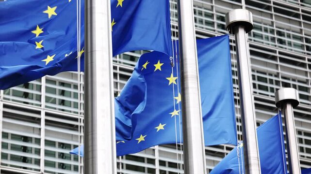 European Union Flags Waving In Strong Wind In Brussels Belgium