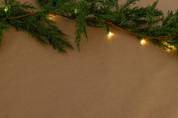 Christmas Garland with Warm Lights on Neutral Background. Minimal Christmas Garland with Warm Light Background.