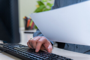 Document Paperwork And Keyboard Typing In Office Workflow, Productivity Administration For Business Computer Data Entry And Report Processing