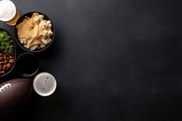 football party essentials, football game essentials laid out on a dark table, including snacks and drinks, with a clean layout and space for text