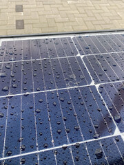 wet solar panel surface with water droplets