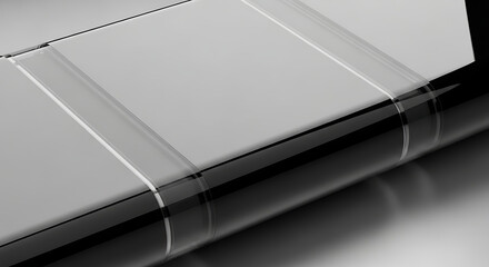 Close-up of a solar panel's edge with reflective surface and thin white lines on a gray background.