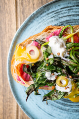 Breakfast served. Delicious bruschetta. Healthy veggie toast with beetroot herbs food. Runny creamy sauce with grilled greens on bread.