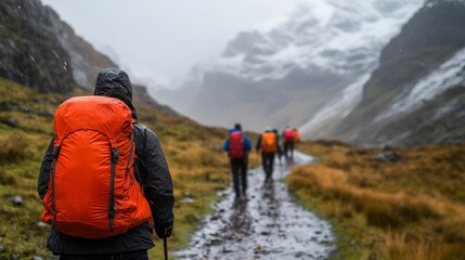A group of hikers treks through a rain-soaked mountain path, showcasing adventure and resilience in challenging weather, Ideal for travel blogs, outdoor gear promotions, or motivational content,