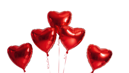 Valentine day collection of five red heart shaped balloons floating together in a bright background product shot isolated