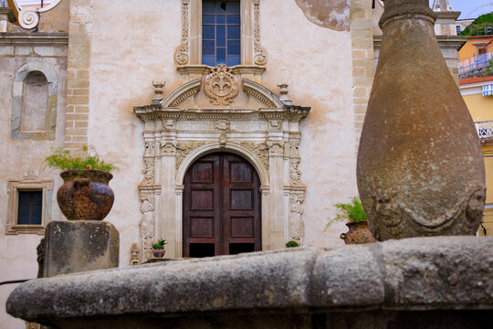 Partial view of the facade of the church of Maria SS. di Montevergine and portal with tuff Baroque decorations, work of Niccol&ograve; Ricciulli in Paola (Calabria)