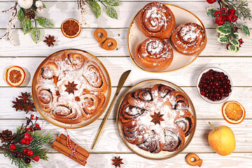 Homemade winter desserts, stollen, rolls, pies, or buns with nuts, cinnamon, cranberries, poppy seeds, and egg liqueur. Festive kitchen banner. Concept for holiday baking, seasonal treats