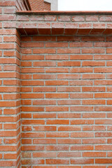 A brick wall where we can appreciate different textures due to the material and some subtle details like a snail. Concept: Textures