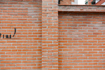 A brick wall where we can appreciate different textures due to the material and some subtle details like a snail. Concept: Textures