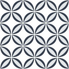 Seamless vector pattern featuring abstract geometric leaf shapes in dark blue and light gray on a clean white background for textiles