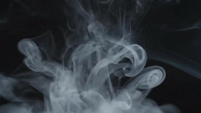Soft flowing smoke waves drifting on a deep black background