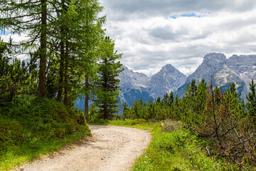 Tourist trail in Dolomites mountain at summer