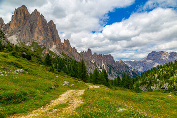 Tourist trail in Dolomites mountain at summer
