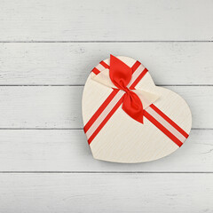 Heart shaped gift box over white