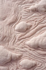 A textured surface made of soft colors.