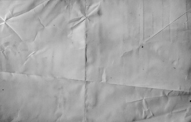 High resolution wrinkled paper texture with visible folds and creases. Minimal grayscale background ideal for design, print, vintage, or abstract layouts.
