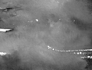 Abstract grayscale background featuring rough concrete texture with scattered paint splashes and streaks, suitable for modern design, urban themes, or artistic overlays.