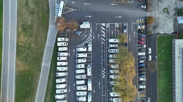 Aerial view highlighting numerous RVs and campers parked at the dedicated facility in Piazzale Azzurri d'Italia, Cremona