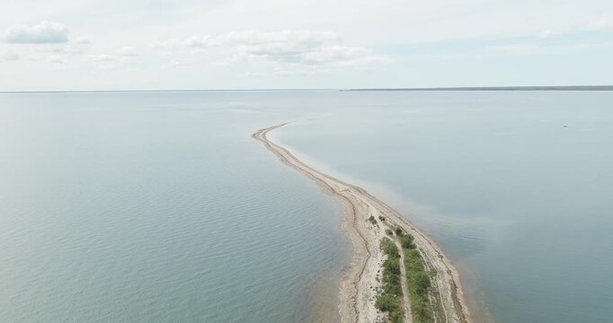 Aerial view of S&auml;&auml;retirp, a narrow peninsula or spit extending into the sea from Kassari island in cloudy spring weather, Hiiumaa, Estonia.
