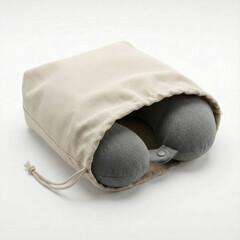Travel neck pillow stored in fabric drawstring pouch