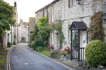 Quiet village street with stone cottages in Grassington, UK