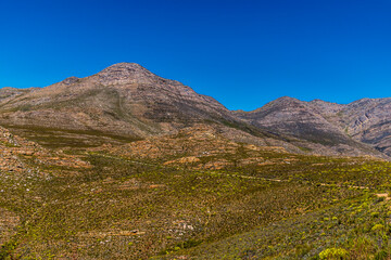 Fototapeta premium A view towards the Swartberg Pass approaching the summit of the Swartberg mountains in South Africa in springtime