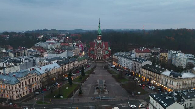 Flight towards St Joseph's Church and Podgorze Market Square in Krakow, Poland