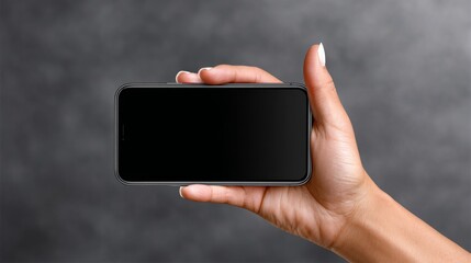 Hand holding smartphone mock up with blank screen, showcasing modern design and sleek aesthetics, ideal for digital marketing and advertising purposes, with copy space for customization