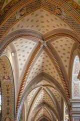 Obraz premium Ornate Vaulted Ceiling With Geometric Patterns and Frescoed Details in Historic Church Interior, Cattedrale di San Lorenzo, Lugano, Switzerland