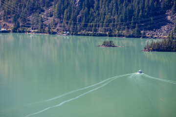 Overlooking Diablo Lake in Washington State tour boat on water