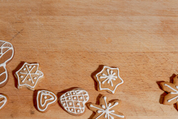 Christmas gingerbread cookies on wooden board with copy space