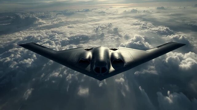 B2 Spirit stealth bomber aircraft flying above clouds representing United States military aviation strategic air power advanced aerospace engineering national defense and modern stealth technology