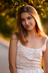 Slavic Woman in Sunlit Garden Wearing White Skirt