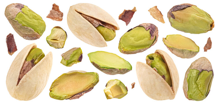 Pistachios whole and chopped isolated on white background, full depth of field