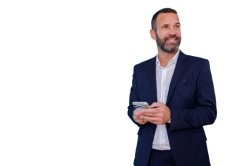 Businessman communicating on smartphone, standing with a smile, looking away, planning and anticipating future success