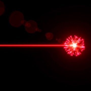 Powerful red laser beam striking a point, creating a vibrant
