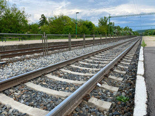 railroad tracks closeup at empty train platform