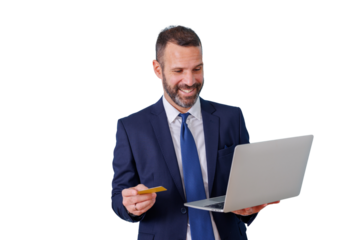 Happy businessman holding credit card and laptop, making online payment, with transparent background