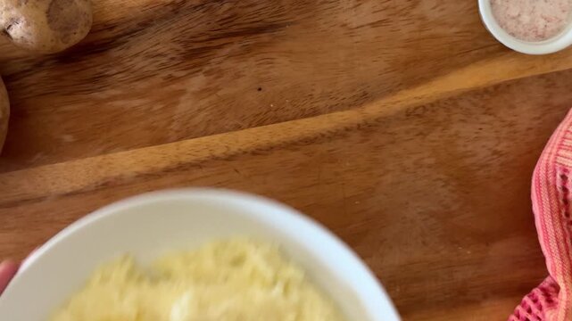 Serving a Bowl of Mashed Potatoes wth Butter 