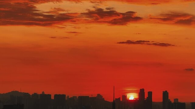 Kuala Lumpur, Malaysia, June 8, 2025: Sunset from an observation deck in Kuala Lumpur. Sunset sky illuminated by twilight, TV tower, and high-rise buildings from the air in the city center. 4K