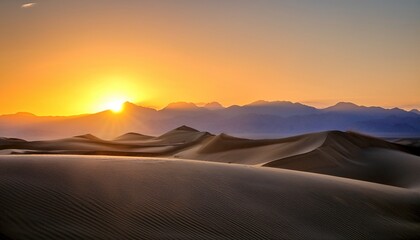 Sunrise Over A Mountain Range And Sand Dunes