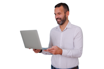 Professional man standing, smiling while holding a laptop, engaged in online communication on transparent background