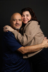 Portrait of adult couple in studio, Latin American ethnicity