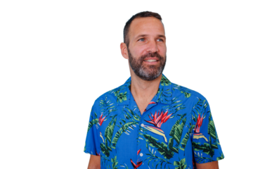 Smiling bearded man wearing a hawaiian shirt looking away and having fun on a transparent background